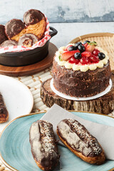 Black forest cake, Schwarzwald pie, dark chocolate and cherry dessert on a white wooden background.