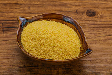 Raw cous cous heap in the bowl