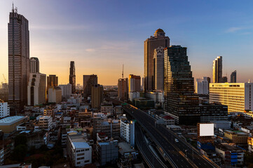 Naklejka na ściany i meble cityscape of Bangkok city skyline with sunset sky background, Bangkok city is modern metropolis of Thailand and favorite of tourists