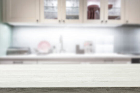 A Wooden Table In The Kitchen Surrounded By A Nice Family Atmosphere