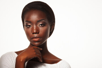 Attractive young african american woman closeup portrait over white background, close up