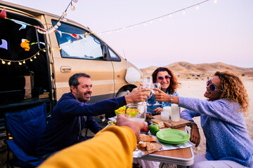Group of adult caucasian people friends enjoy and celebrate together in friendship outdoor with...