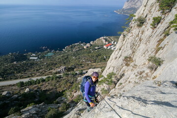 Naklejka premium Rock climbing on Via Ferrata in Crimea, Russia.
