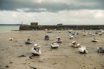 Low tide panoramic view at Granville, France	
Boats lying on the sea floor at low tide near...