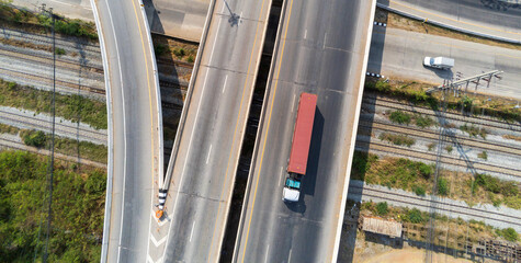 Aerial view of cargo Truck on highway road with red container, transportation...