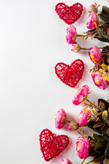 Flowers and red hearts on a white background for Valentine's Day