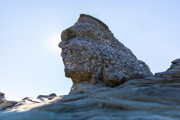 rocks in the mountains look like human head