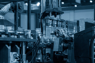 The preform shape of PET bottle in the blowing mold machine. The operation of PET bottle processing by blowing process with the blowing mold.