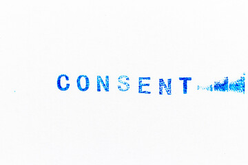 Blue color ink of rubber stamp in word consent on white paper background