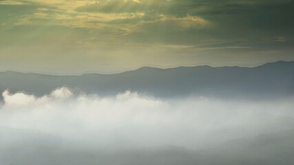 Mountain peaks above the clouds.