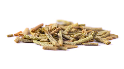 Pile of dried rosemary leaves isolated on white background. Macro photo