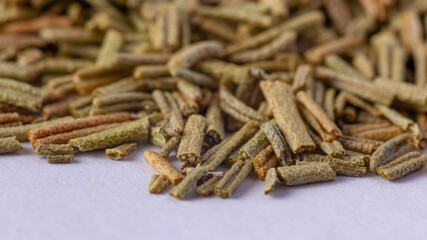 Pile of dried rosemary leaves isolated on white background. condiments