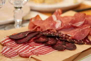 Set of meat cold cuts on wooden table