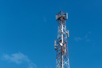 Photo of 5G antenna over blue clean sky.