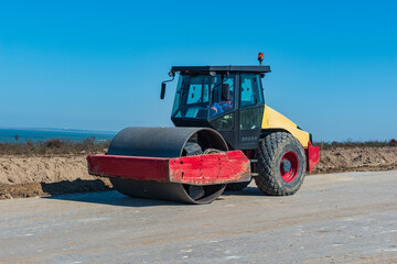 modern road construction equipment roller for tamping and compacting asphalt, soil and other surfaces