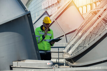  engineer people service on cooling tower check belt and fan blade. cool ,construction,engineer,site,management,safety,civil,workers