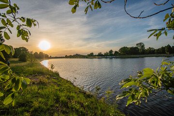 beautiful werdersee, a river in bremen surrounded by green at sunset