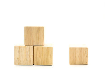Photos of four brown wood blocks. On a white background on the left of the picture are three wooden blocks. On the right side of the picture there is one block.