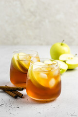 Summer mocktail, apple honey iced tea in glasses. Space ofr text.