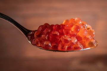 Red caviar on a small spoon
