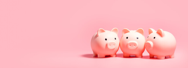 Piggy banks on isolated pink background with copy space. Panoramic Banner for Money Saving Concepts