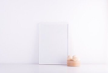 Blank white text frame on a white table. interior light style with easter eggs