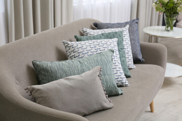 Sofa with pillows in modern living room interior