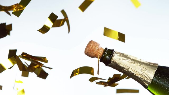 Super slow motion of Champagne explosion, opening champagne bottle closeup. Filmed on high speed cinema camera, 1000fps