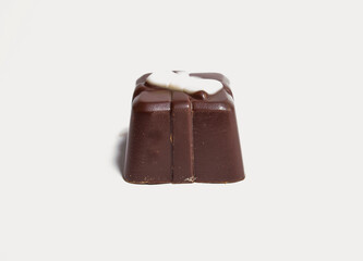 One, separate chocolate candy on a white background up close