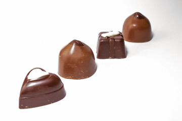 set of different chocolates in one line on a white background