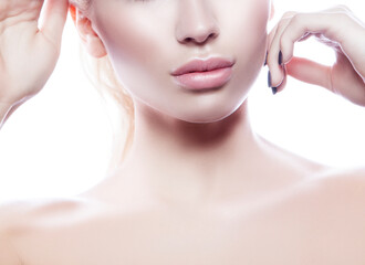 Lips. Part of beauty face and body of young adult woman with clean fresh skin, natural make-up. Isolated. White background