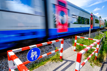 Fototapeta na wymiar typical railroad crossing in germany