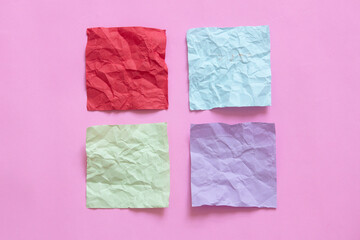Obraz premium four crumpled note paper on pink background