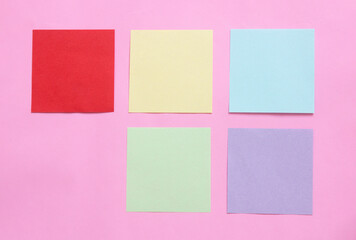 multicolor of sticky note paper on pink background