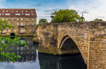 The view across the River Great Ouse along the old bridge at Riverside, Godmanchester in springtime