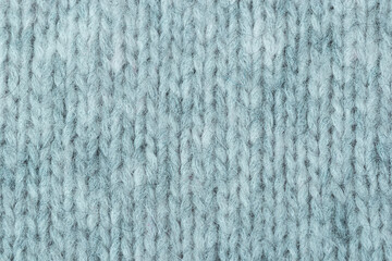 knitted wool texture. Light gray background close up . Hobby concept