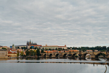 Fototapeta na wymiar Vltava river in Prague. Karluv most or Charles bridge