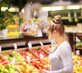  Supermarket shopping, face mask and gloves,woman buying vegetables at the market.