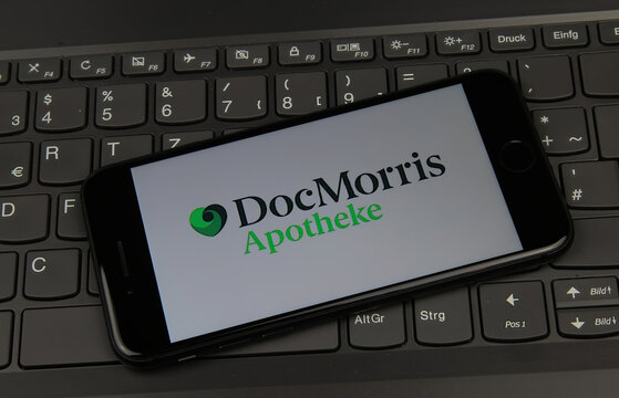 Viersen, Germany - May 9. 2020: Close up of mobile phone screen on computer keyboard with logo lettering of online mail-order pharmacy doc morris