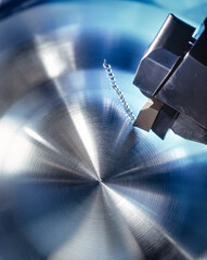 An iron spindle in the process of milling.