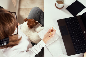 Remote work. Online cources, distance education and e learning concept. Woman in headphones listen audio course at laptop