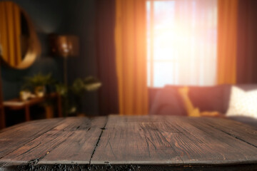 A wooden table in the living room on a moody evening