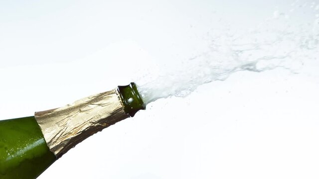 Super slow motion of Champagne explosion, opening champagne bottle closeup. Filmed on high speed cinema camera, 1000fps