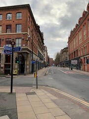 City street in Manchester City centre with buildings in the background. 