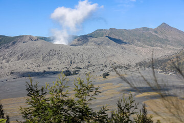 Fototapeta na wymiar volcano with a volcanic smoke. volcano that still active. Erupting Volcano, Mount Bromo, Indonesia. 