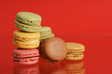 Colorful french macarons on background