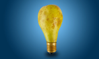 Pear in the form of an electric light bulb on a blue background
