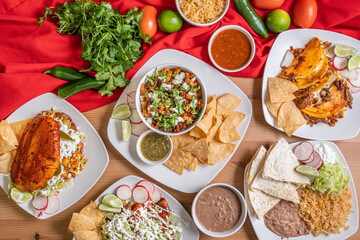 Authentic Mexican food. Carnitas rice bowl, chicken flautas, cheese quesadilla, hand made corn tortilla chips. 