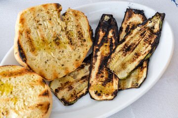 Grilled zucchini served with grains. Traditional Greek dish.