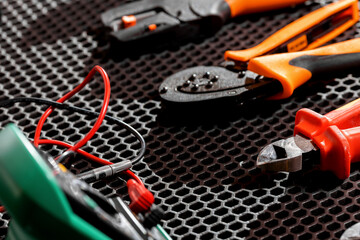 Black table with industrial equipment and tools for installation, repair and maintenance of...